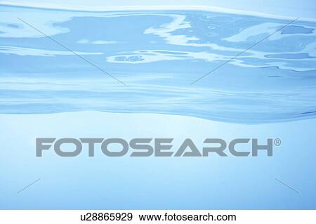 Stock Photo - Cross section of water, close up, blue background. Fotosearch