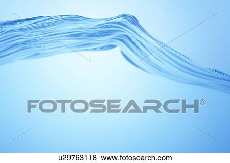Stock Photo - Cross section of water, close up, blue background, copy space. Fotosearch