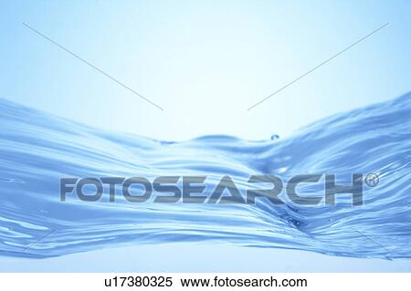 Stock Photography - Cross section of water, close up, blue background. Fotosearch
