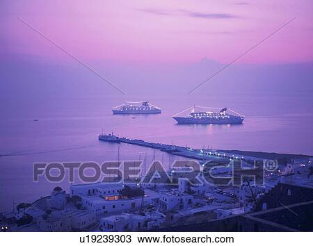 Stock Image - Cruise ships in Mykonos harbour in the evening, Mykonos, Greece. Fotosearch