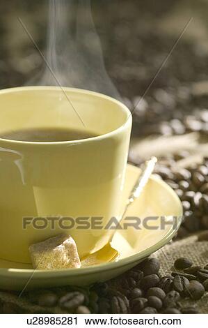 Cup of coffee and coffee beans View Large Photo Image Stock Image - Cup of coffee and coffee beans. Fotosearch