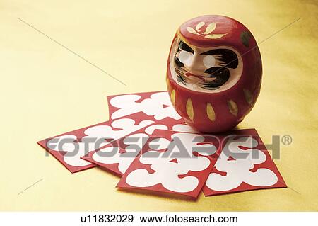 Daruma doll and Japanese New Years playing cards View Large Photo Image Stock Photo - Daruma doll and Japanese New Years playing cards. Fotosearch