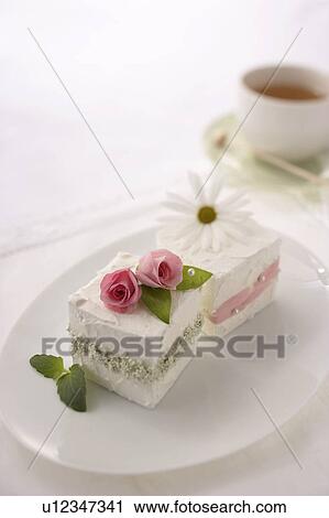 Stock Image - Dessert with flowers on top. Fotosearch