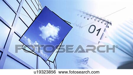 Stock Photograph - Digital composite of reflected blue sky, a building and desk calendar. Fotosearch