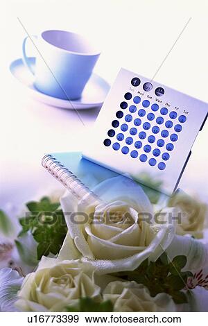 Stock Photo - Digital composite of wedding bouquet, coffee cup and calendar. Fotosearch
