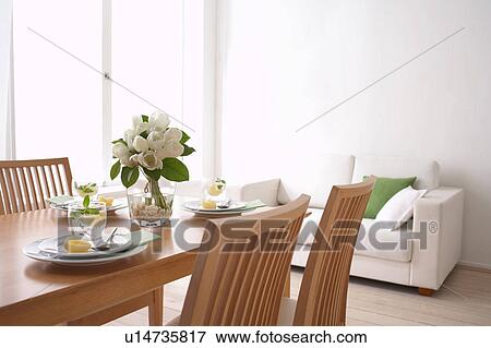 Stock Photo - Dining table with plates and glasses. Fotosearch