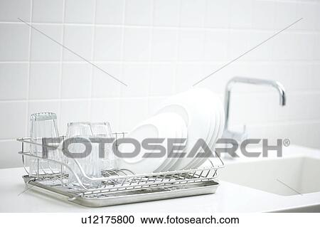 Stock Image - Dishes on a dish rack. Fotosearch