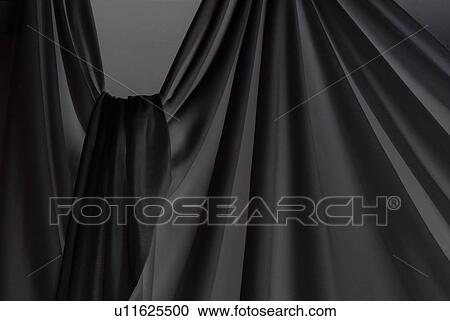 Stock Image - Draped black cloth. Fotosearch