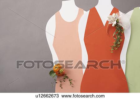 Stock Image - Dresses with corsage, purple background. Fotosearch