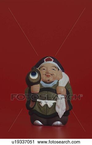 Stock Image - Figurine of Daikoku, one of the seven lucky Gods. Fotosearch