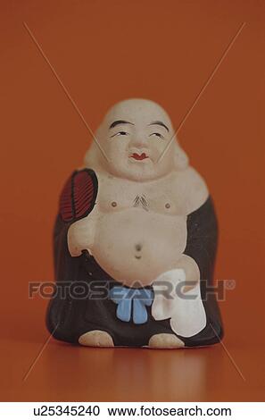 Stock Image - Figurine of Daikoku, one of the seven lucky Gods. Fotosearch