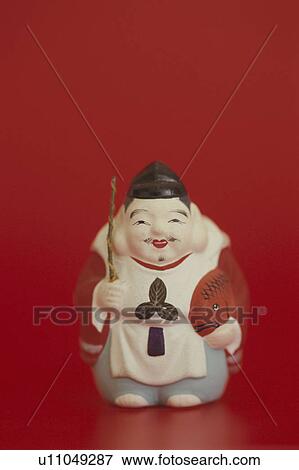 Stock Photo - Figurine of Ebisu, one of the seven lucky Gods. Fotosearch