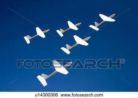 Stock Photograph - Five paper airplanes flying. Fotosearch