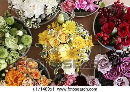 Flowers arranged in buckets View Large Photo Image Stock Image - Flowers arranged in buckets. Fotosearch