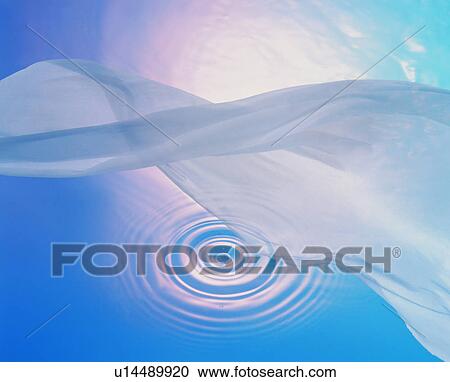 Stock Image - Flowing fabric over rippled water surface. Fotosearch
