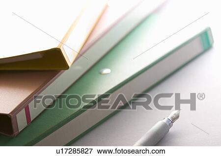 Stock Photo - Folders and a fountain pen. Fotosearch
