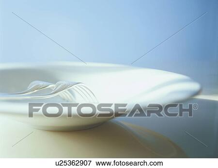 Stock Photo - Forks in large white plate. Fotosearch