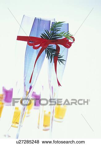 Four champagne glasses tied with ribbon View Large Photo Image Stock Photo - Four champagne glasses tied with ribbon. Fotosearch