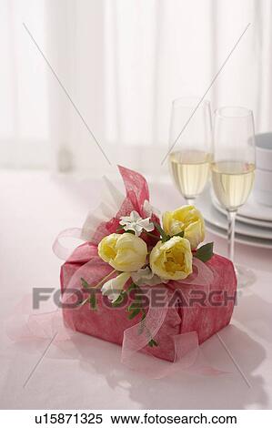 Gift with flower arrangement View Large Photo Image Stock Photography - Gift with flower arrangement. Fotosearch