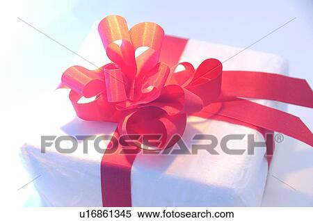 Gift with red ribbon View Large Photo Image Stock Photography - Gift with red ribbon. Fotosearch
