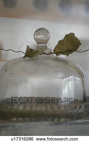 Stock Photograph - Glass cakestand with leaves. Fotosearch