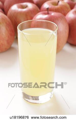Glass of apple juice amongst apples View Large Photo Image Stock Photograph - Glass of apple juice amongst apples. Fotosearch