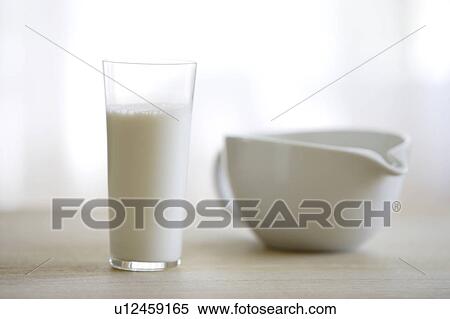 Glass of milk and a milk jug View Large Photo Image Stock Photography - Glass of milk and a milk jug. Fotosearch