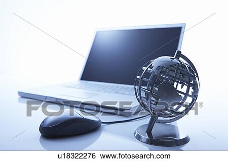 Stock Photograph - Globe and a laptop. Fotosearch