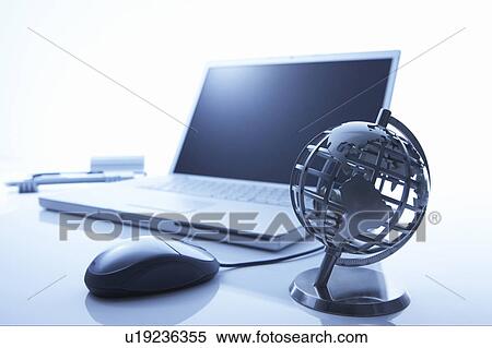Stock Photography - Globe and a laptop. Fotosearch