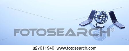 Stock Image - Globe and two mobile phones. Fotosearch