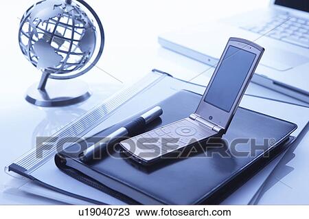Globe on a desk with business accessories View Large Photo Image Stock Image - Globe on a desk with business accessories. Fotosearch