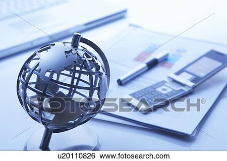 Globe on a desk with business accessories View Large Photo Image Stock Photograph - Globe on a desk with business accessories. Fotosearch