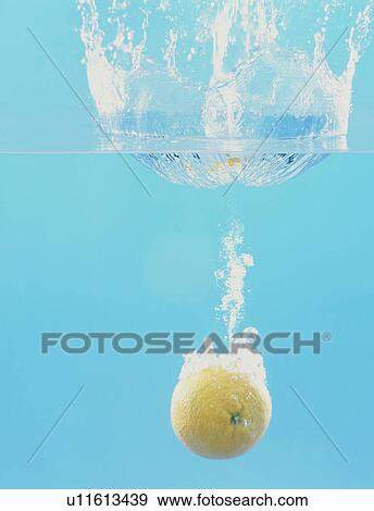 Grapefruit falling into water View Large Photo Image Stock Photo - Grapefruit falling into water. Fotosearch