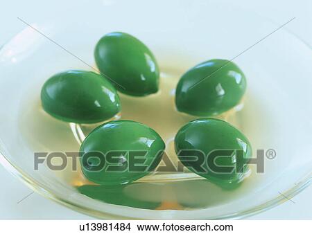 Green olives in a bowl of water View Large Photo Image Picture - Green olives in a bowl of water. Fotosearch