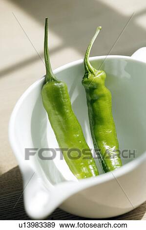 Green peppers in a jug View Large Photo Image Stock Photo - Green peppers in a jug. Fotosearch