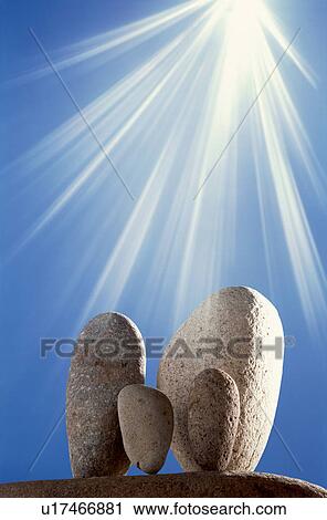 Stock Image - Group of rocks under sunlight. Fotosearch