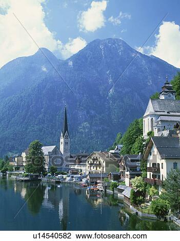 Stock Image - Halstatter Lake with surrounding village and mountains, Salzkammergut, Austria. Fotosearch