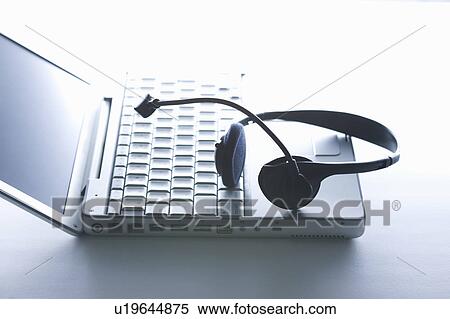 Stock Photography - Headset and a laptop. Fotosearch