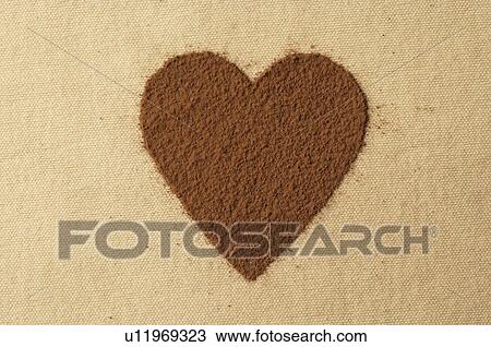 Stock Image - Heart made of cocoa powder. Fotosearch