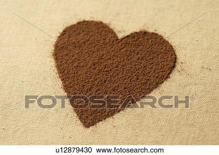 Stock Image - Heart made of cocoa powder. Fotosearch