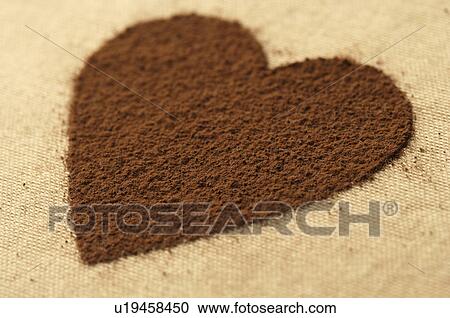 Stock Image - Heart made of cocoa powder. Fotosearch