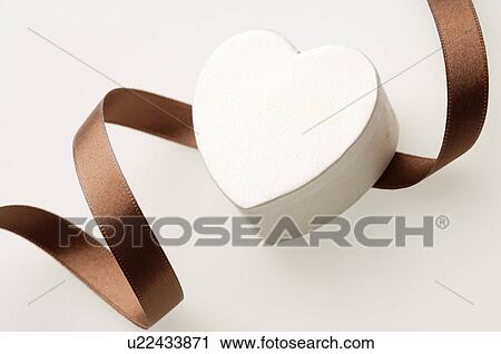 Stock Image - Heart shaped box and a ribbon. Fotosearch