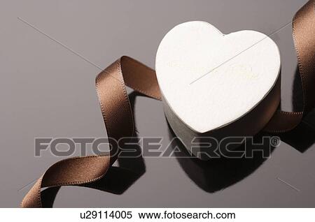 Stock Photography - Heart shaped box and a ribbon. Fotosearch