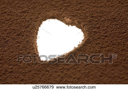 Stock Photo - Heart shaped space in cocoa powder. Fotosearch