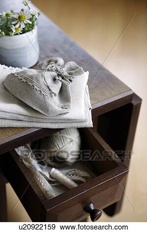 Stock Photo - Hemp products in a wooden desk. Fotosearch