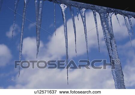 Stock Photo - Icicles with sky and clouds. Mt Yatsugatake, Yamanashi Prefecture, Japan. Fotosearch