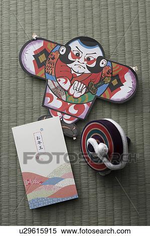 Stock Photography - Japanese kite, spinning top and New Years money envelope. Fotosearch