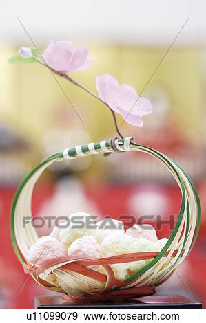 Stock Photo - Japanese sweets with peach flowers. Fotosearch