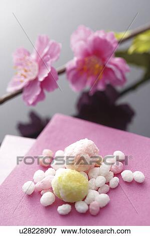 Stock Photo - Japanese sweets with pink flower. Fotosearch
