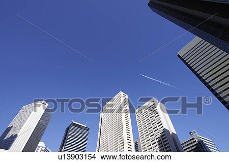Jet stream over a Shinjuku high-rise complex, Shinjuku-ku, Tokyo, Japan View Large Photo Image Picture - Jet stream over a Shinjuku high-rise complex, Shinjuku-ku, Tokyo, Japan. Fotosearch